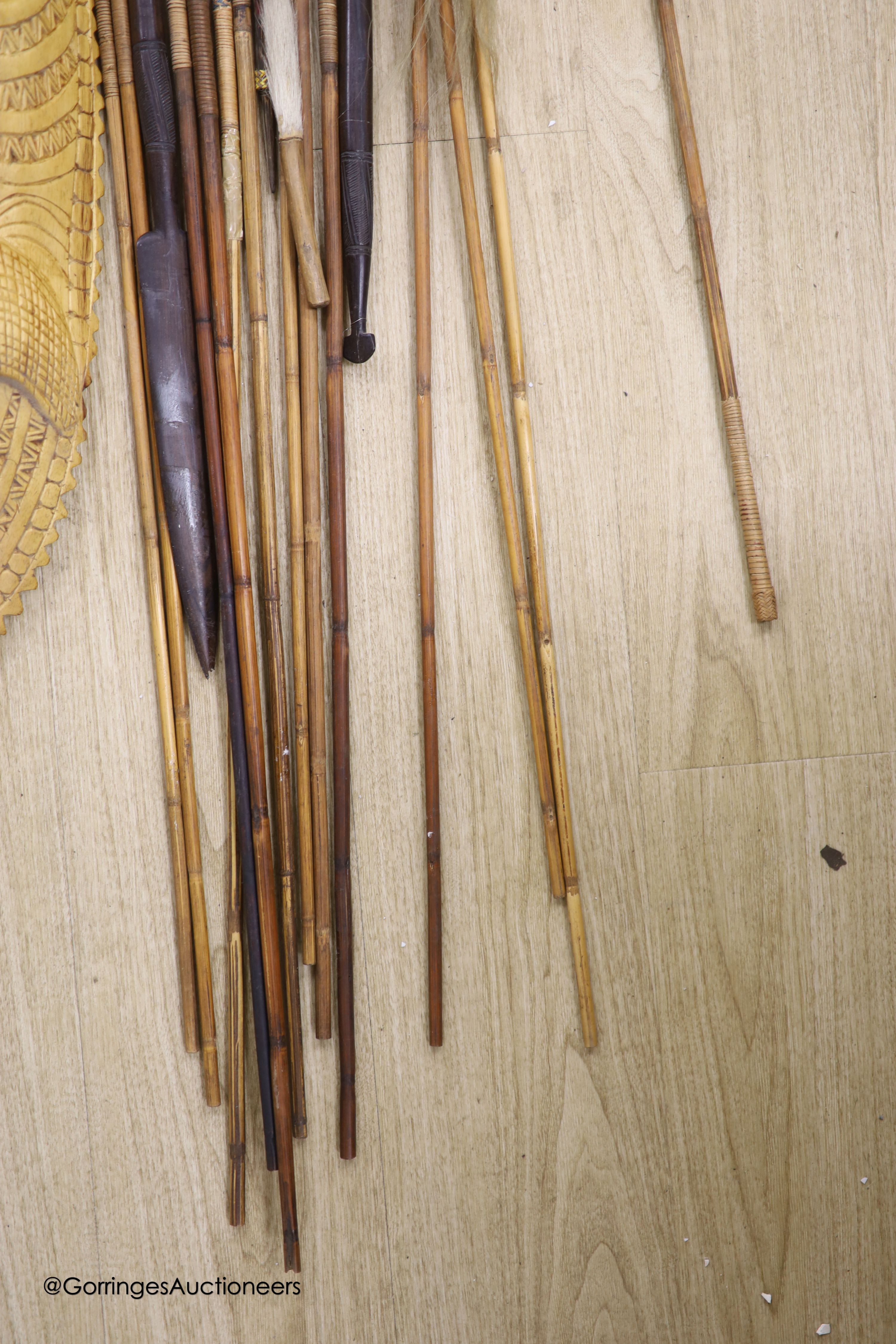 A collection of Tribal style spears etc and a mask